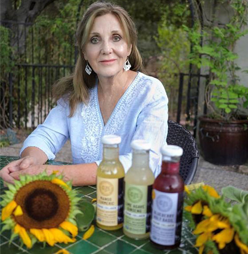 Photo of woman with Pure Wild Bottles