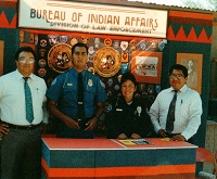 OJSPhotoPage.MemoryLane officer at BIA booth
