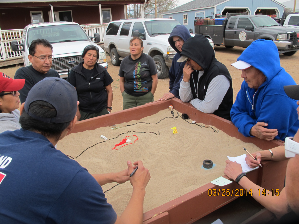 Firefighters from Navajo Nation train using sand tables.