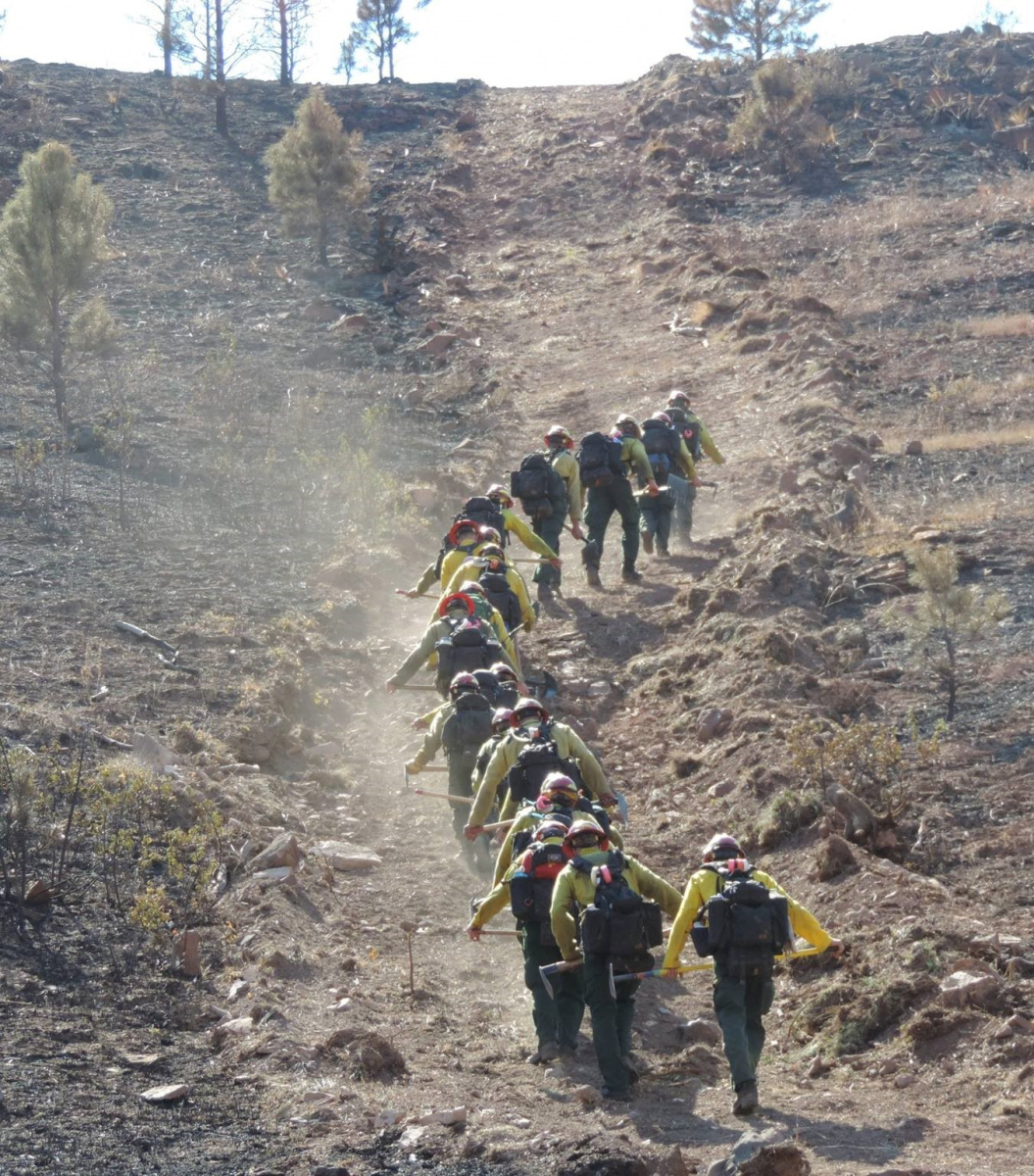 Northern Cheyenne Agency Type 2 Initial Attack Crew hikes a containment line on way, 2017.