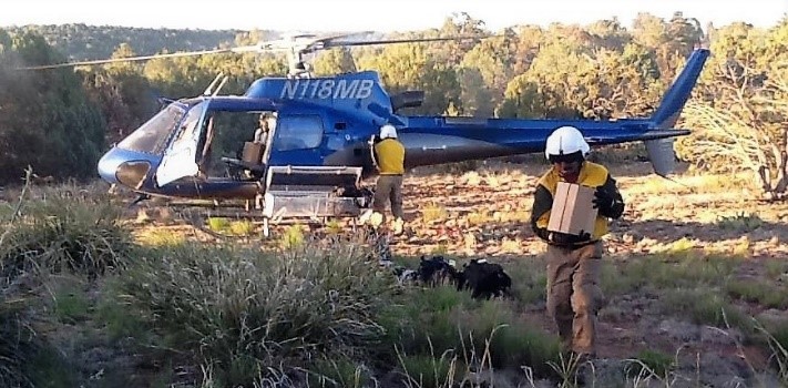 Mescalero helitack personnel deliver cargo to a helispot during a wildfire. Photo: BIA