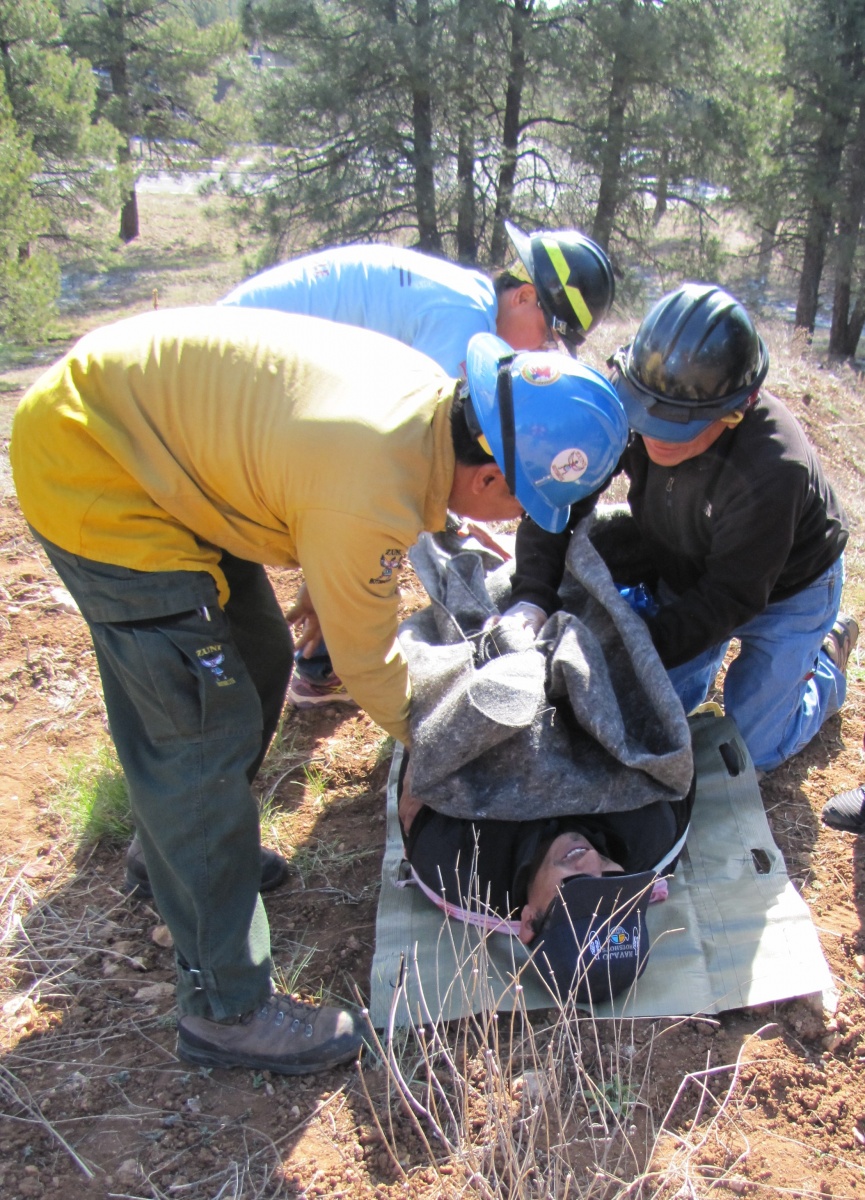 BIA Medical Incident Technicians learn how to package a patient in the wildland fire environment. BIA Photo by Michelle Moore, Program Coordinator