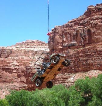 Navajo Region's A-star B-3 helicopter slings an ultra-terrain vehicle into the Supai Village, Grand Canyon, AZ.
