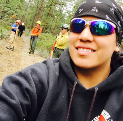 Yolanda Yallup takes selfie with some classmates in the background at the 2016 Central Oregon Ecological Training Exchange