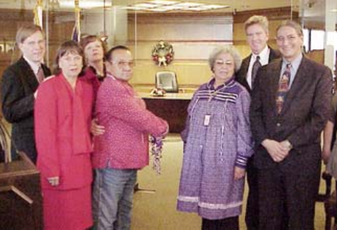 L-R: Robert Lamb, DOI; Sharon Blackwell, BIA; Debra Maddox, BIA; Norman Hill, Wolf Clan Runner, Tonawanda Seneca Nation; Evelyn Jonathan, Wolf Clan Mother, Tonawanda Seneca Nation; Tim Vigotsky, NBC; and Kevin Gover, DOI/BIA, get ready to cut the ribbon dedicating the Ely s. Parker Building in Reston, VA. 