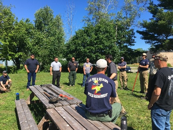 Students attending basic wildland firefighting training discuss lessons from class. Photo: Lucas Minton, BIA Fire Management Officer, Eastern Region Students attending basic wildland firefighting training discuss lessons from class. Photo: Lucas Minton, BIA Fire Management Officer, Eastern Region