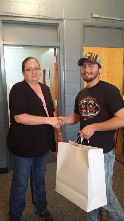 Wendy Wells (left) and Russell Felicia shake hands during luncheon welcoming Russel to Rosebud Agency. Photo: BIA