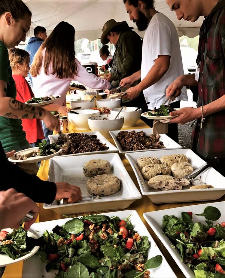 Photo of people serving themselves buffet style