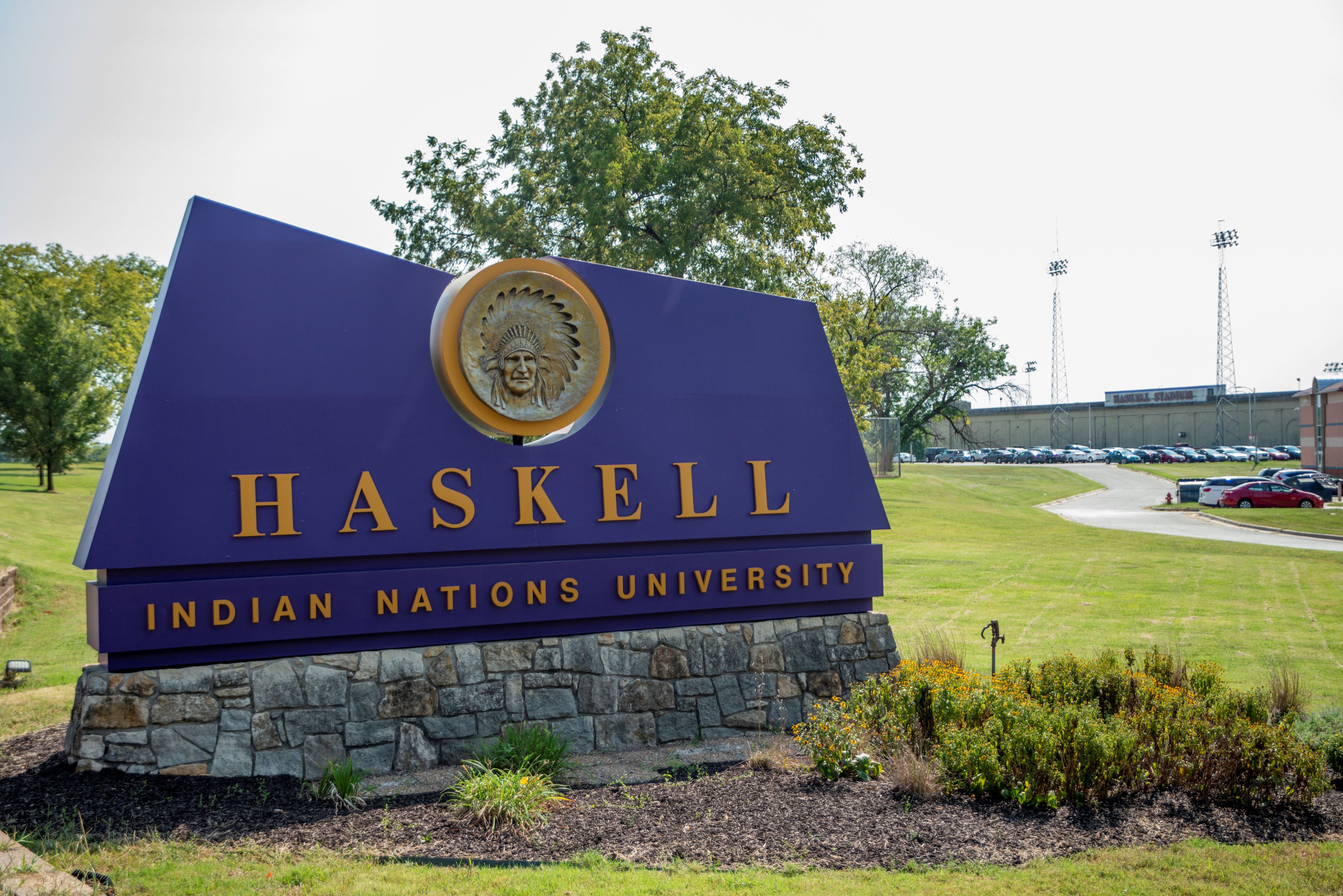 A photo of the Haskell Indian Nations University sign on campus.
