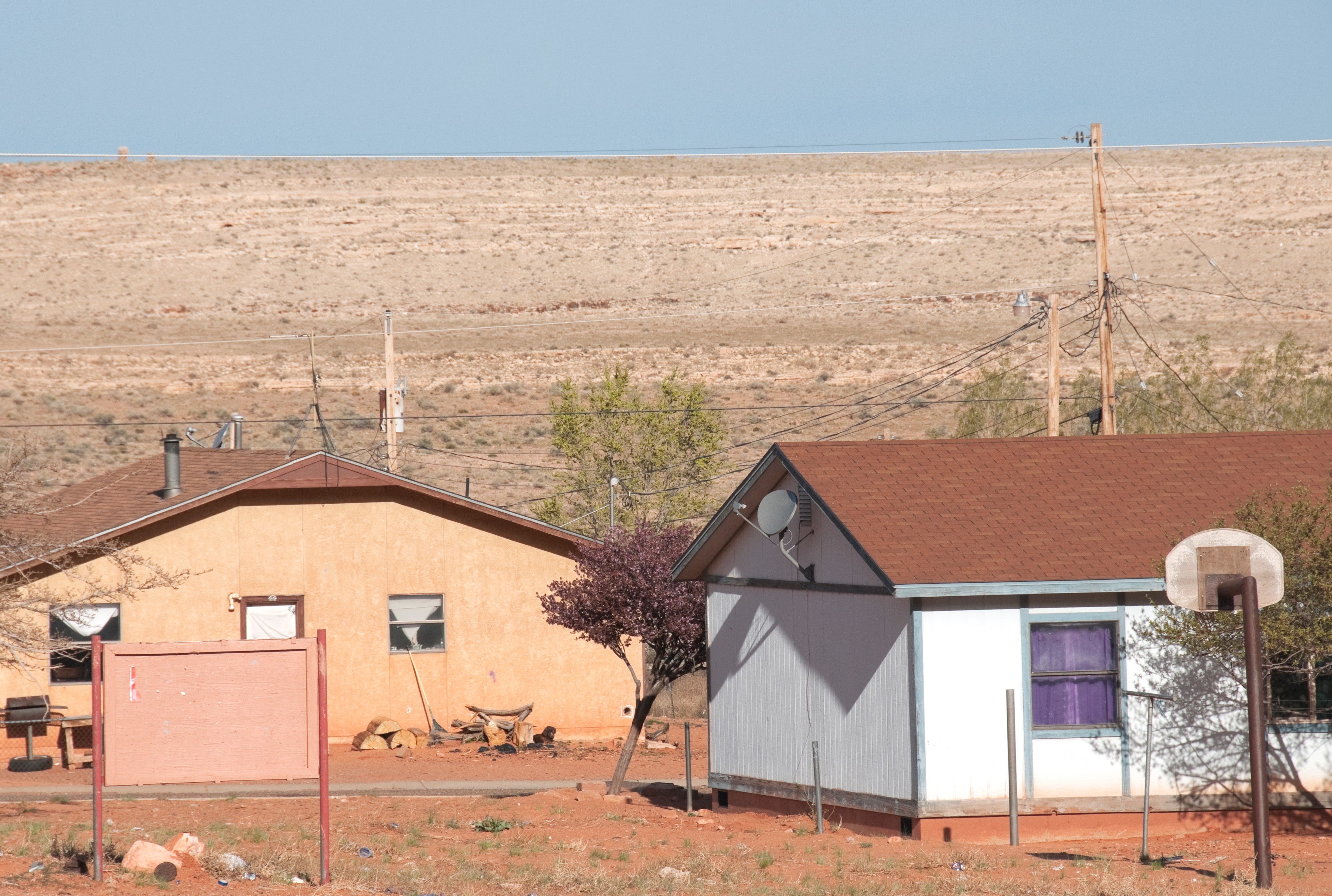 A photo of Tribal housing with access to electricity on Navajo Nation. 