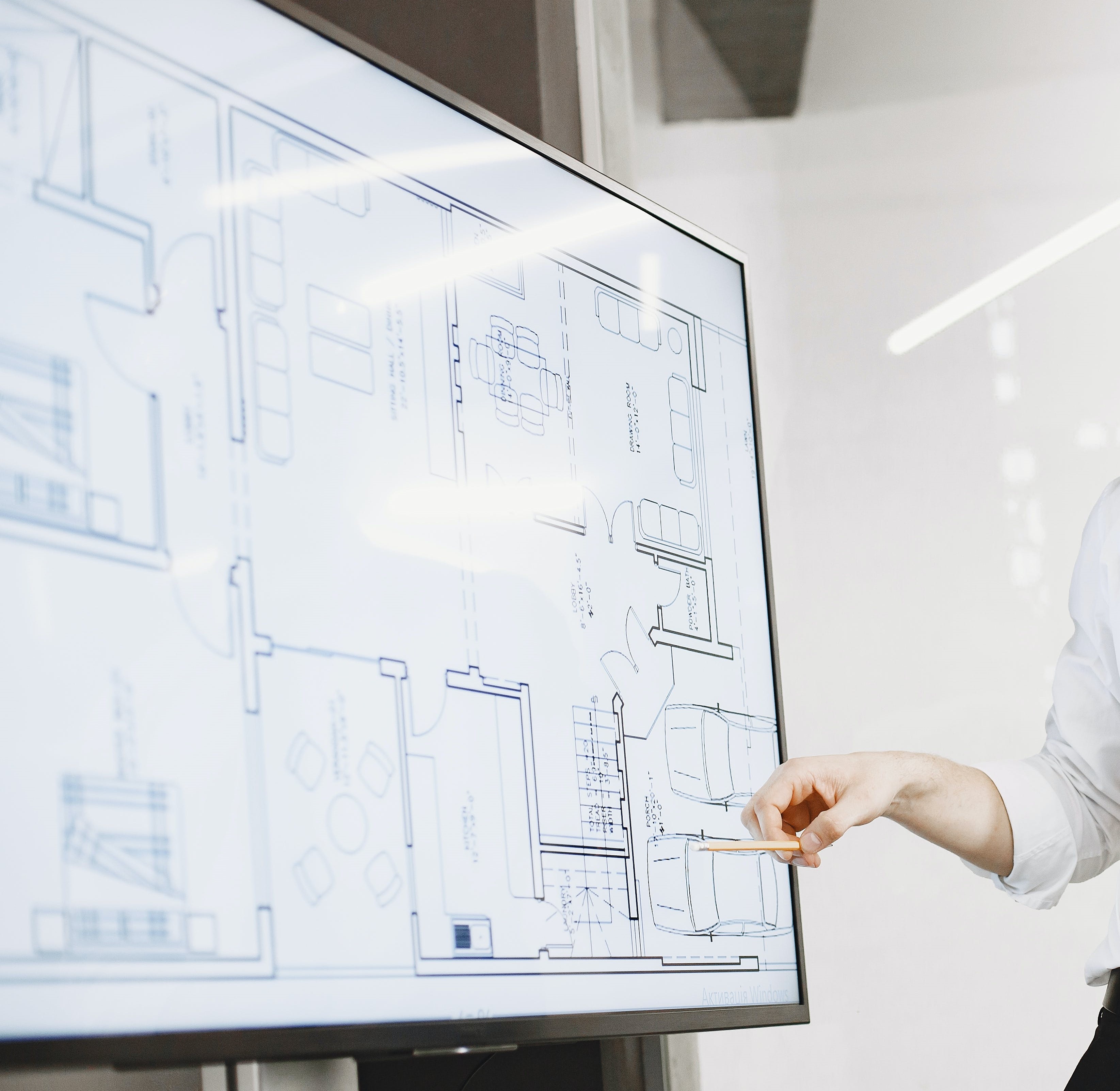 A photo reviewing blueprints for an infrastructure project. 