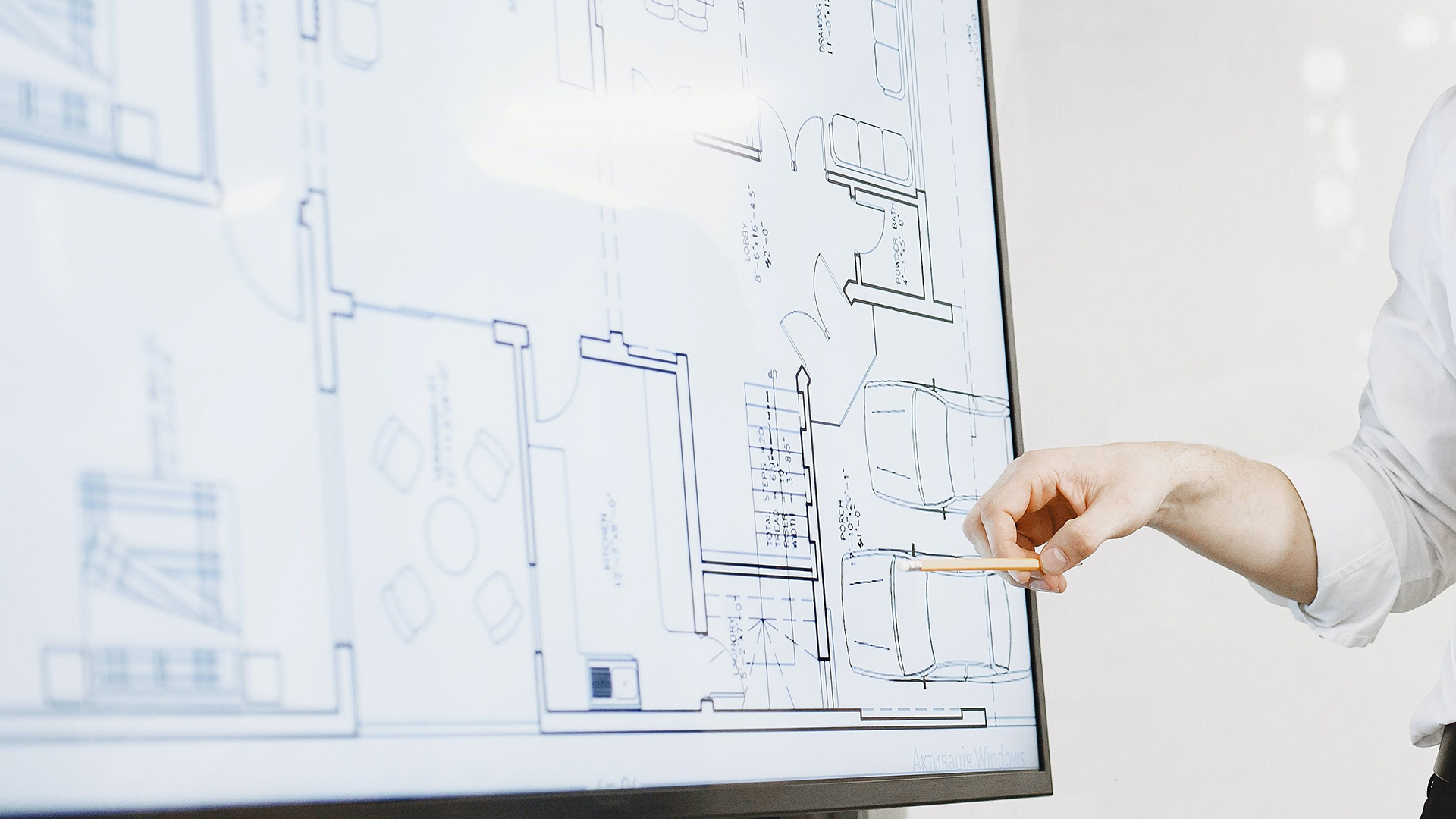 A photo reviewing blueprints for an infrastructure project. 