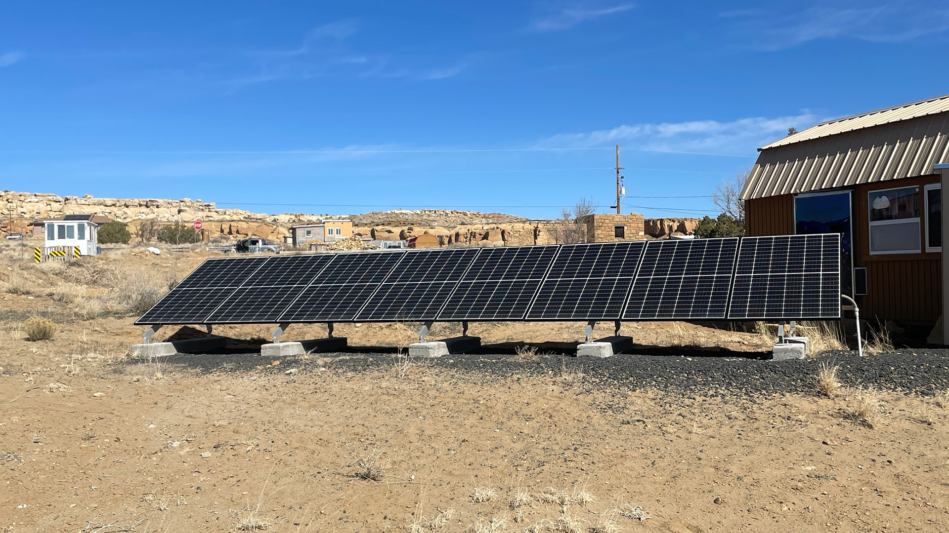 Solar panels outside of a building in Indian Country producing electricity. 