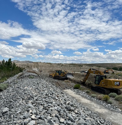 Step 1: A trench is dug to place the rock of the fuse plug into.