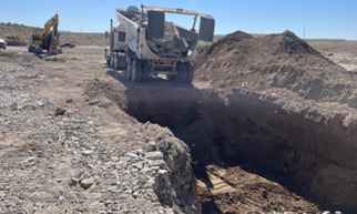 Initial riprap placement in the cutoff trench near the fish ladder