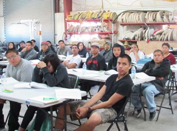 New Firefighters at San Carlos prepare to complete applications during a 2017 job fair.