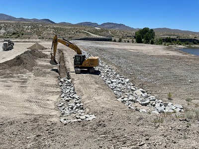 excavated approximately half of the 4’x4’ cutoff trench and filled it with riprap