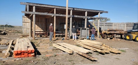 The BIA Timber Team visiting the Rosebud Sioux Tribal Forestry mill and watching the local staff cut ponderosa pine into boards for different projects at the Tribe's timber mill.