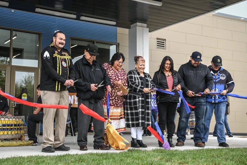 The ribbon is cut on the Ombimindwaa Gidinawemaaganinaadog Intergenerational Wellness Building during a grand opening ceremony on Wednesday, Oct. 11, 2023, in Red Lake.Madelyn Haasken / Bemidji Pioneer