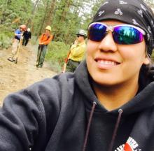 Yolanda Yallup takes selfie with some classmates in the background at the 2016 Central Oregon Ecological Training Exchange