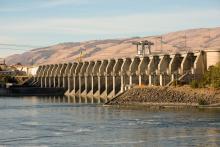 A photo of a dam in the distance on tribal land.