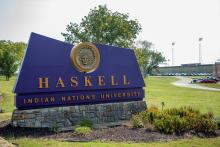 A photo of the Haskell Indian Nations University sign on campus.