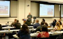 Aaron Baldwin, BIA Wildland Fire Management Fire Director, presents career opportunities to student attendees at a Tribal fire/forestry student summit in Flagstaff, AZ.