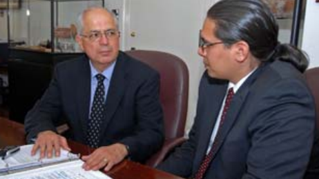 Interior Assistant Secretary-Indian Affairs Larry Echo Hawk (left) confers with his advisor Wizipan Garriott on efforts to address Indian Country’s social and economic issues