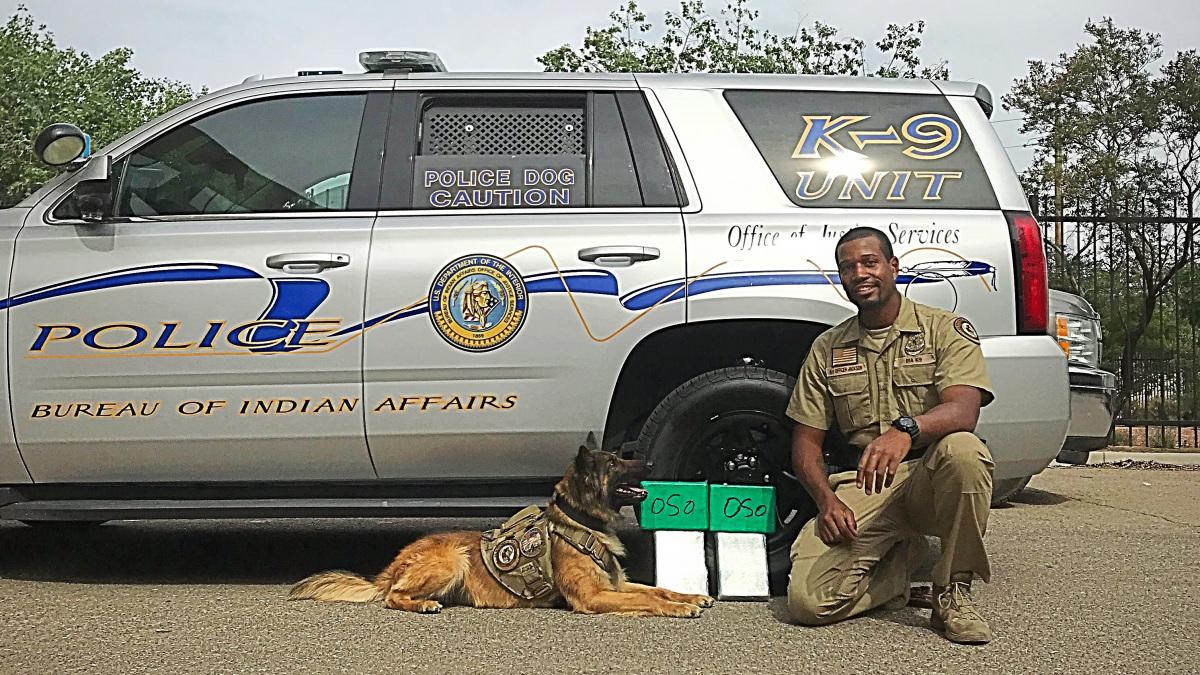 BIA Officer Jackson and K9 Kofi with seized heroin.