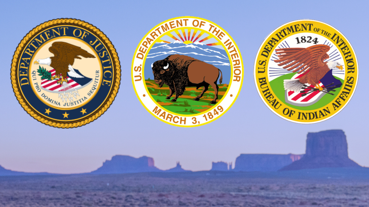 DOJ, DOI and BIA logos over a photo of Hopi land.