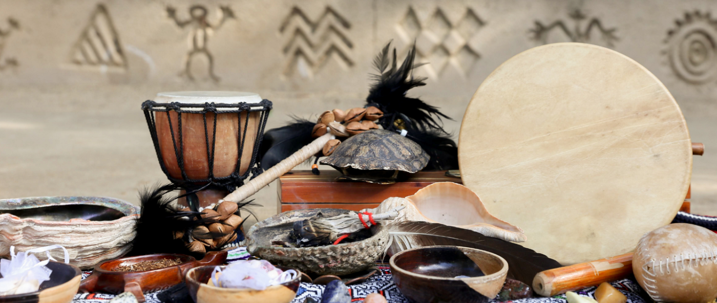 A table is laid out with a variety of ceremonial Tribal items.