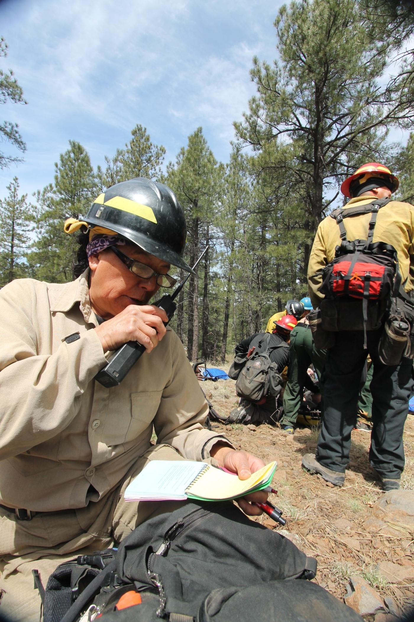 A firefighter reports an incident during a BIA Wildland Fire First Aid Program training.