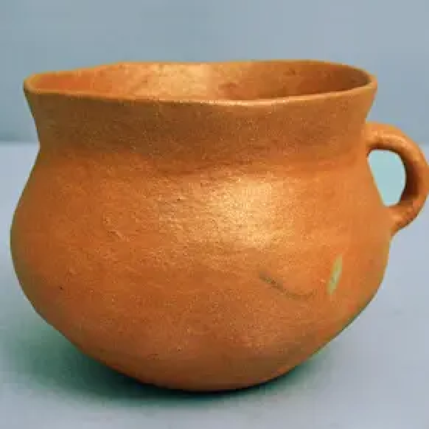 Micaceous pot with handle. From the BIA Museum collection.