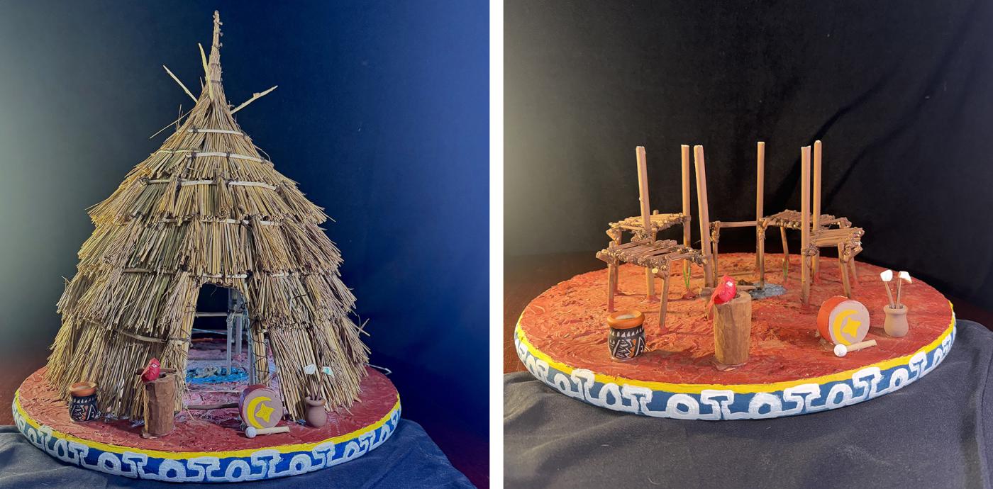 Sculpture of a kirikir?i:s (Wichita) grasshouse made from woven prairie grasses and red dirt. Inside the house are smaller scultpures of traditional items such as pottery, a corn mill, and a drum.